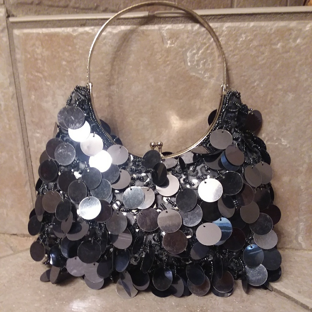 Small sparkly blue hand purse